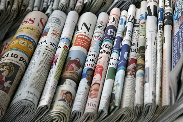 Various Indian News Papers' are displayed at a road side shop in New Delhi, India.